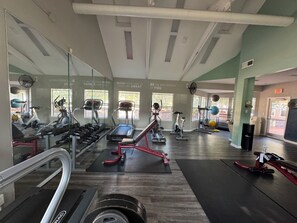 A gym with treadmills, elliptical machines, and free weights. - a 4/2 cozy apt near UF and Shands Hospital (Gainesville)