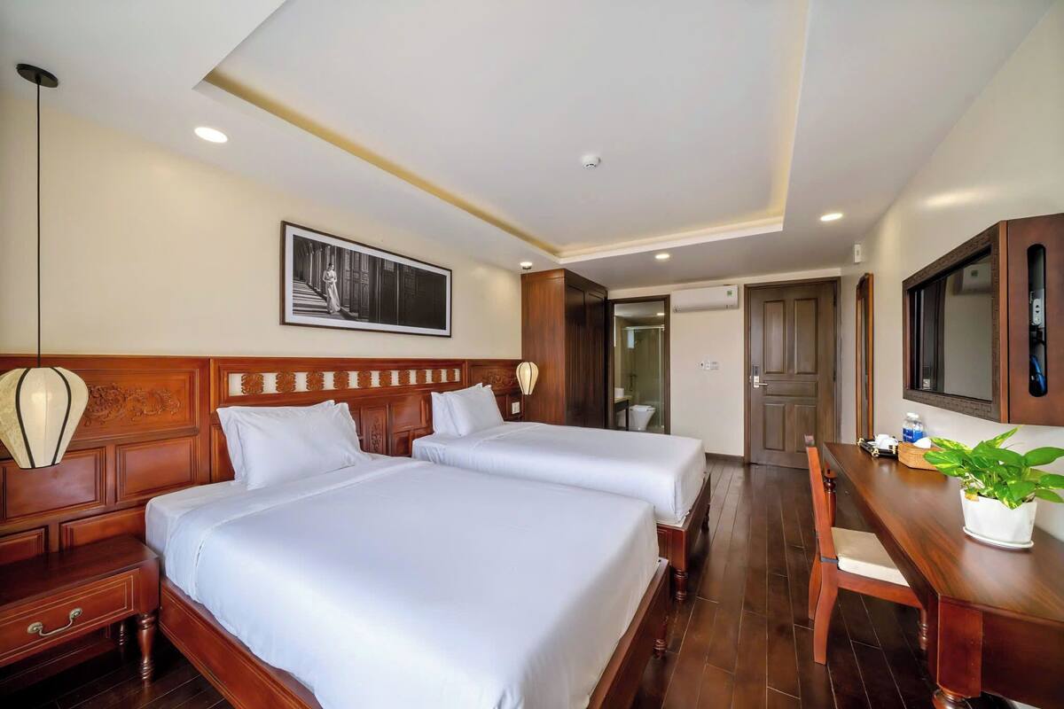 Standard Room, City View | Desk, laptop workspace, blackout drapes, iron/ironing board