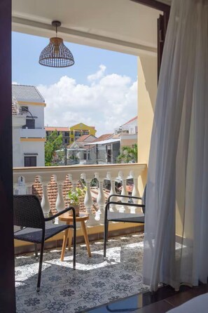 Desk, laptop workspace, blackout drapes, iron/ironing board