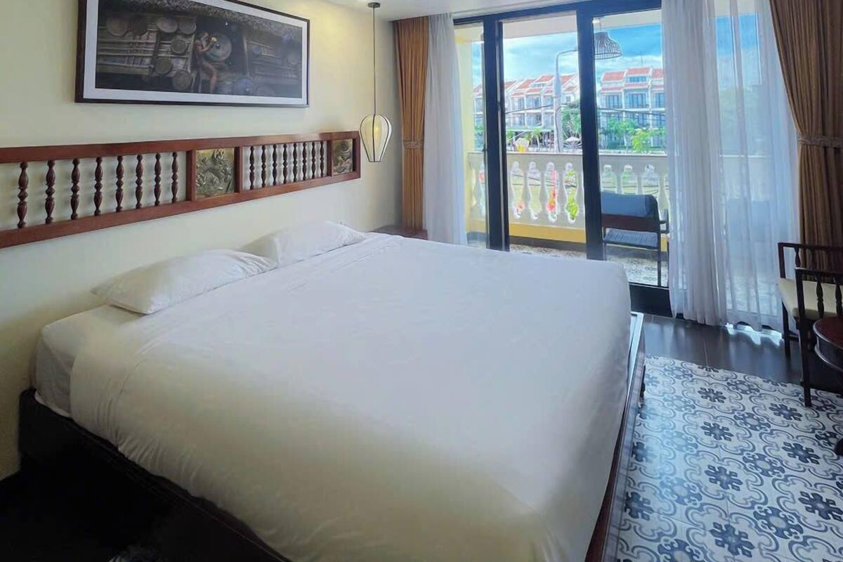 Desk, laptop workspace, blackout drapes, iron/ironing board