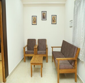 Deluxe Apartment | Living area | 42-inch LED TV with cable channels