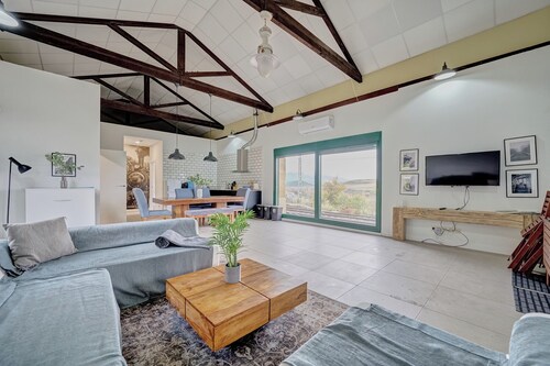 Train station among vineyards ideal for wine tourism and train enthusiasts.