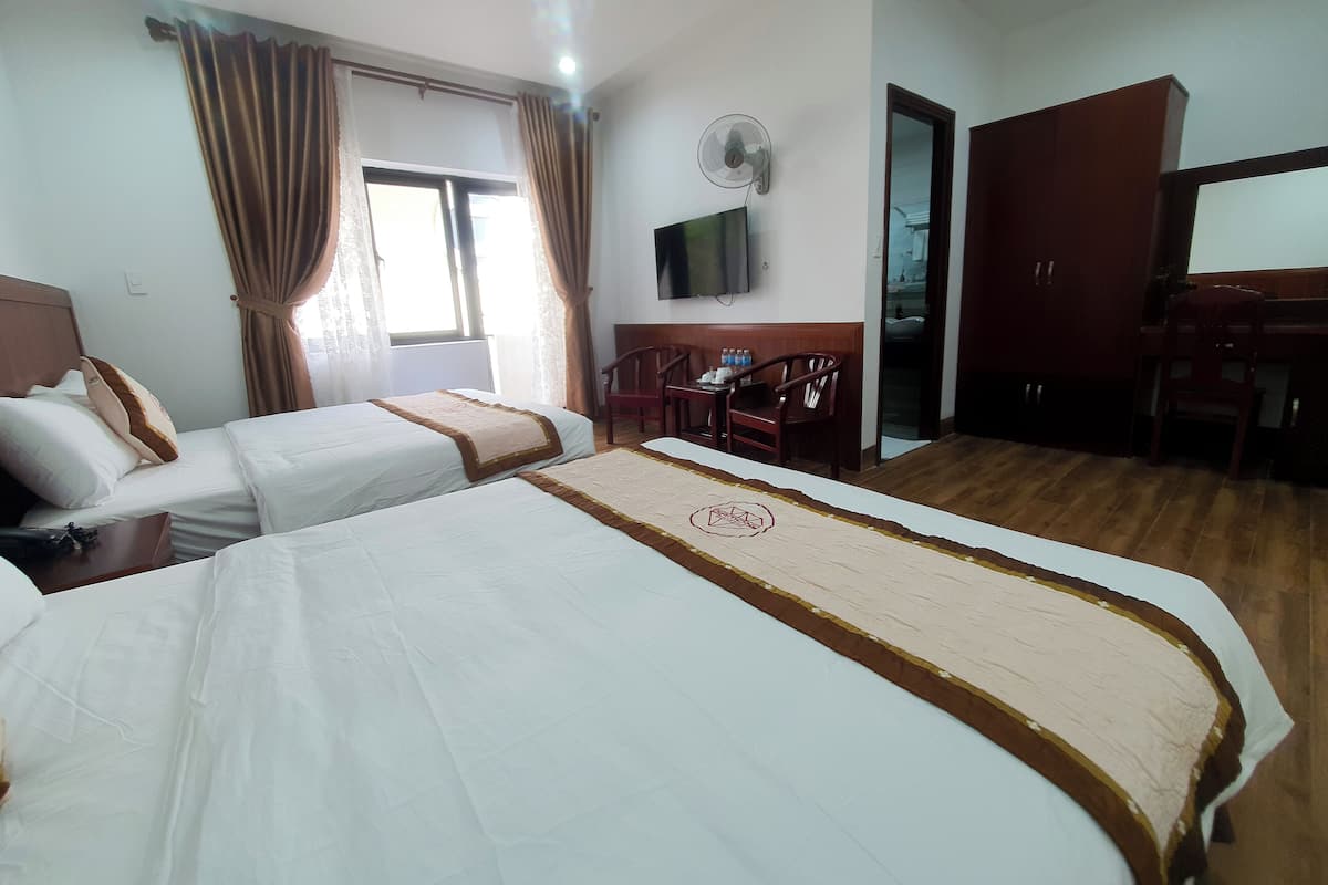 Deluxe Room, 2 Queen Beds | Premium bedding, desk, laptop workspace, blackout drapes