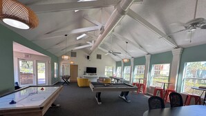 A recreational room with a pool table, foosball table, and ping pong table. - Spacious 4-bedroom apartment centrally located and near UF and Shands Hospital (Gainesville)