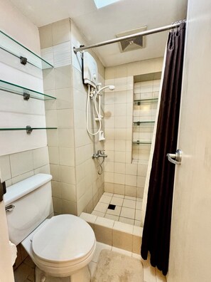 Shower, towels, soap, toilet paper