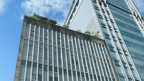 A hotel building with multiple stores on the ground floor, including Comfy Inn and other retail outlets. - Comfy Inn Mabini Manila (Manila)