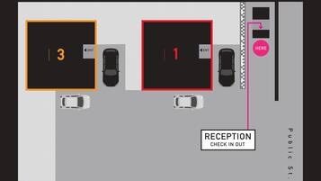 A parking layout with numbered parking spaces and a reception area.