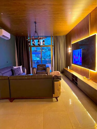 This 2 bedroom retreat features elegant interiors, a serene private garden.