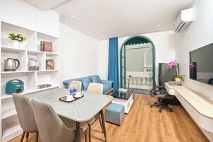 Luxury Apartment, Balcony, Pool View | Desk, laptop workspace, free WiFi