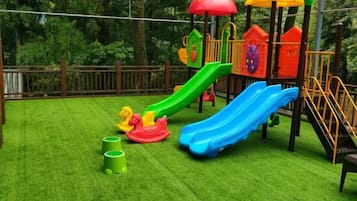 A playground with slides and climbing structures.