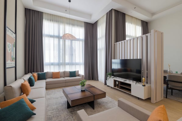 Departamento, 2 habitaciones, vista al jardín | Área de sala de estar