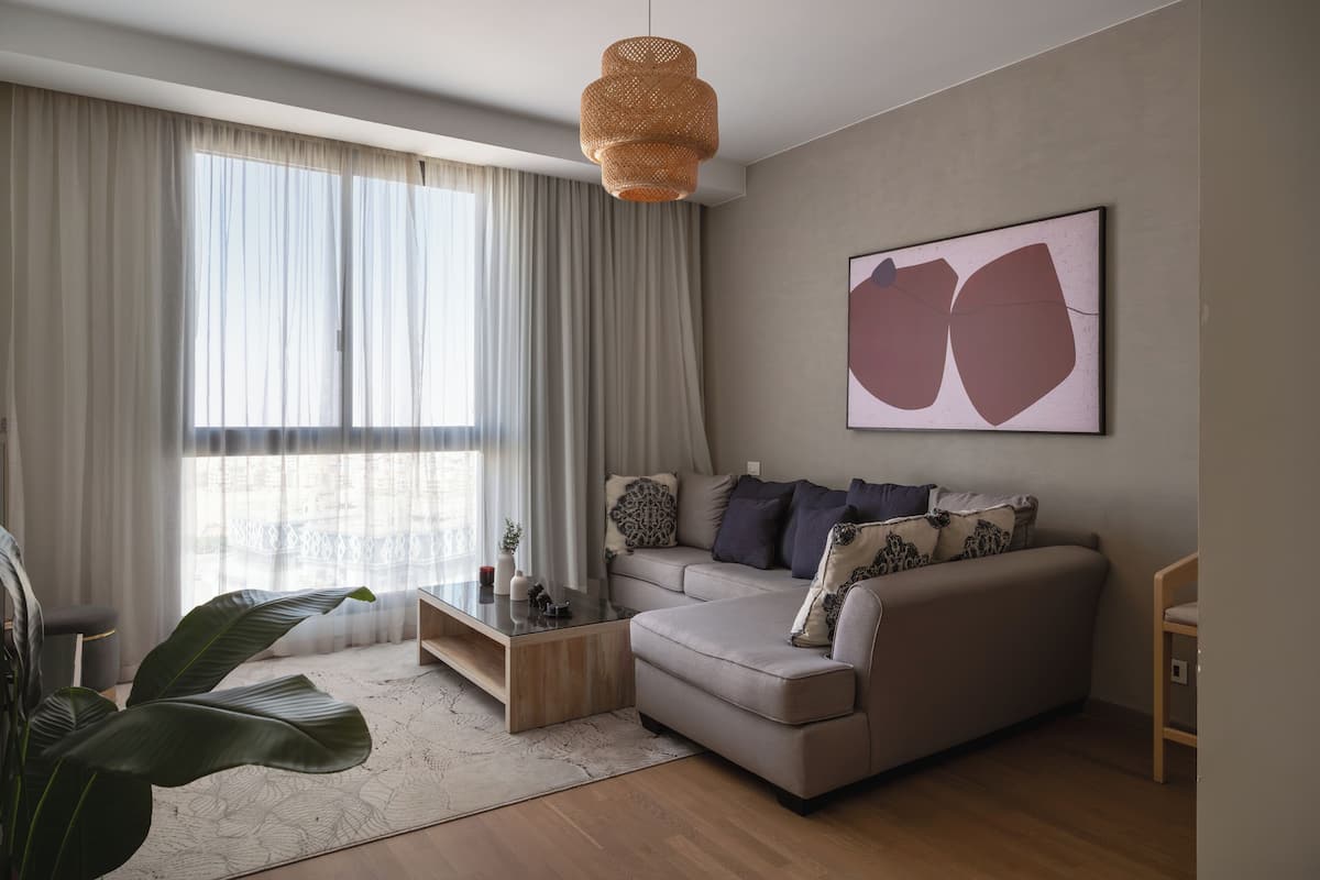 Apartamento, vista para a cidade | Área de estar