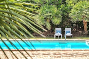 Seasonal outdoor pool, pool umbrellas, pool loungers