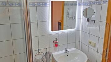 Shower, towels, soap, toilet paper