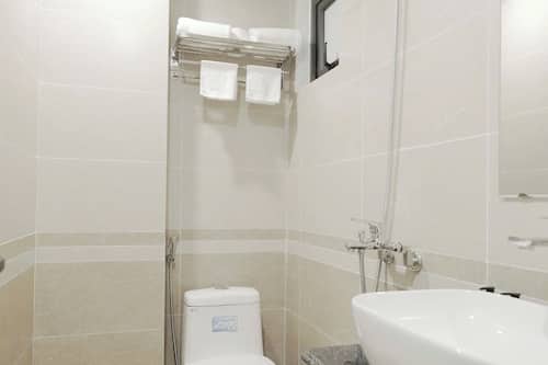 Separate bathtub and shower, rainfall showerhead, hair dryer, slippers