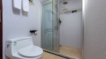 Shower, hair dryer, slippers, towels