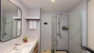 Shower, hair dryer, slippers, towels