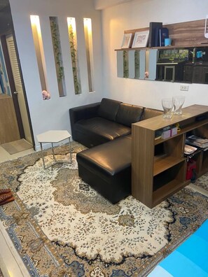 Studio, meerdere slaapkamers, uitzicht op de stad | Woonkamer