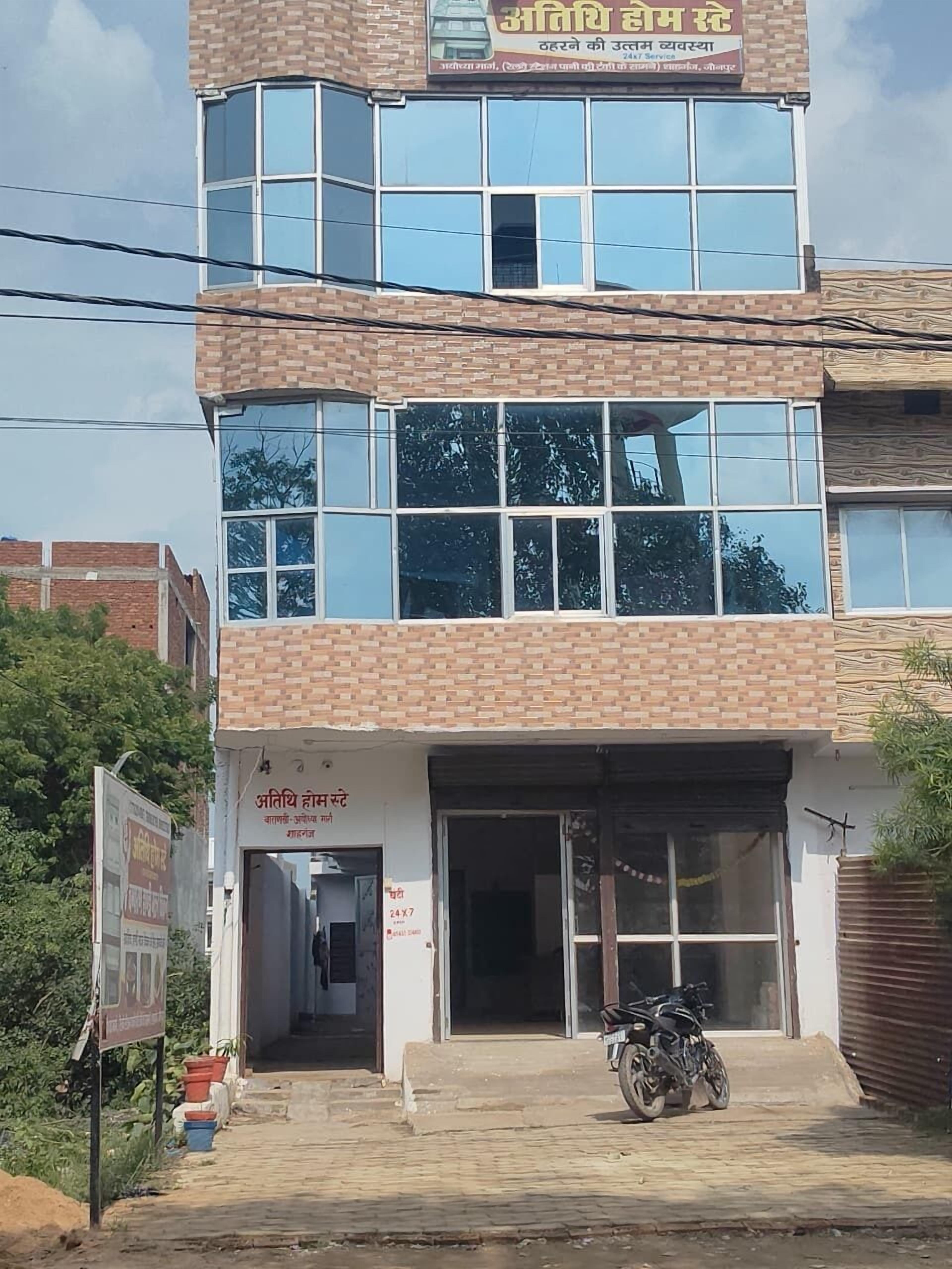 A two-story building with a signboard indicating it is a hotel.