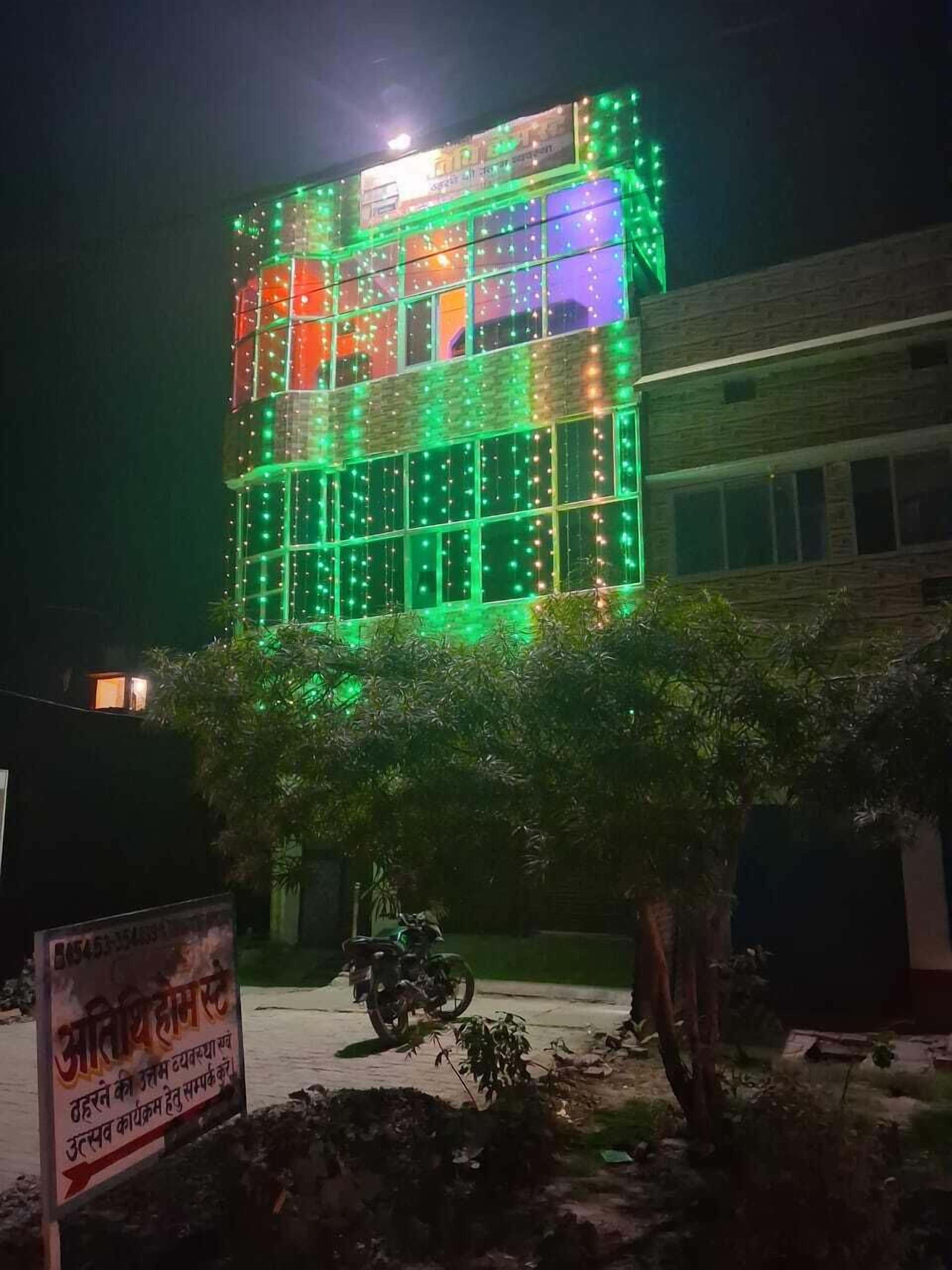 A building with colorful lights and a sign in a local language.