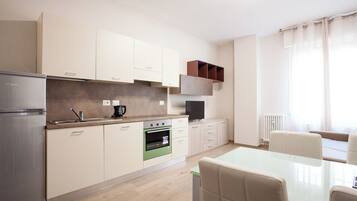 Suite Bilocale 2 persone | Vardagsrum | Platt-tv