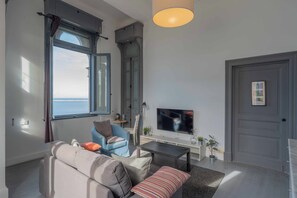 Apartamento, vistas a la ciudad | Zona de estar