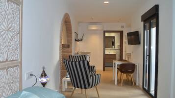 Superior Studio | Living area | 49-inch LED TV with premium channels, first-run movies, pay movies