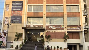 A multi-story hotel with a sign for 'Elite Hotel' and 'Multi Cuisine Family Restaurant' on the ground floor. - Elite Hotel Karimnagar (Karimnagar)