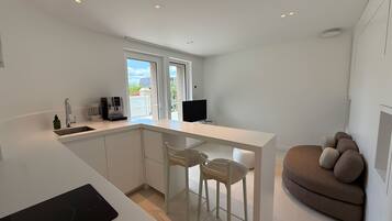 Apartment, Garden Area | Private kitchen | Mini-fridge, microwave, oven, stovetop