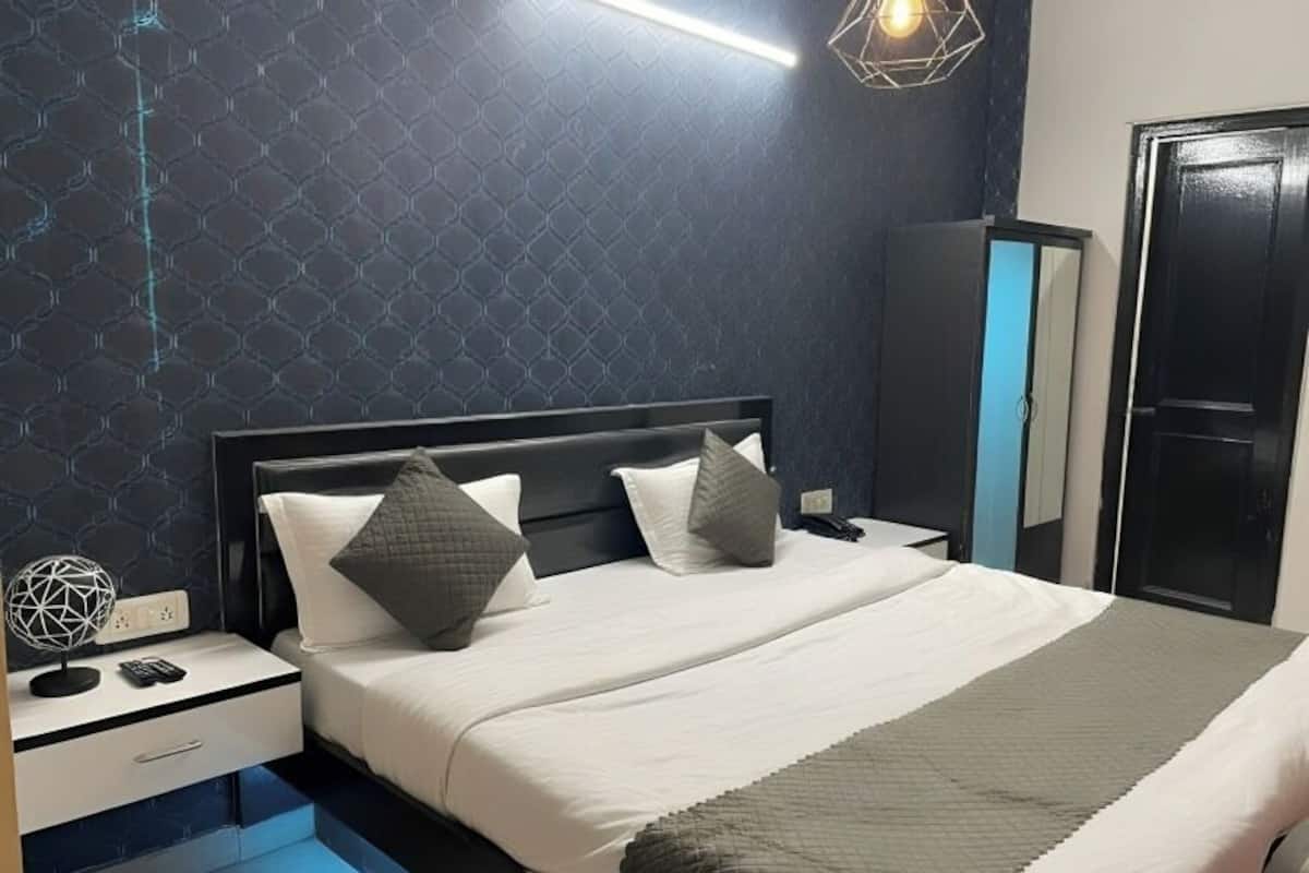 Habitación superior | Cortinas opacas, tabla de planchar con plancha, camas supletorias