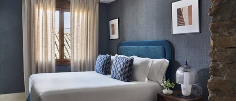 Premium bedding, down comforters, in-room safe, laptop workspace