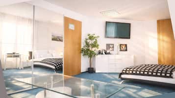 Deluxe Apartment, Resort View | Desk, laptop workspace, blackout drapes, soundproofing