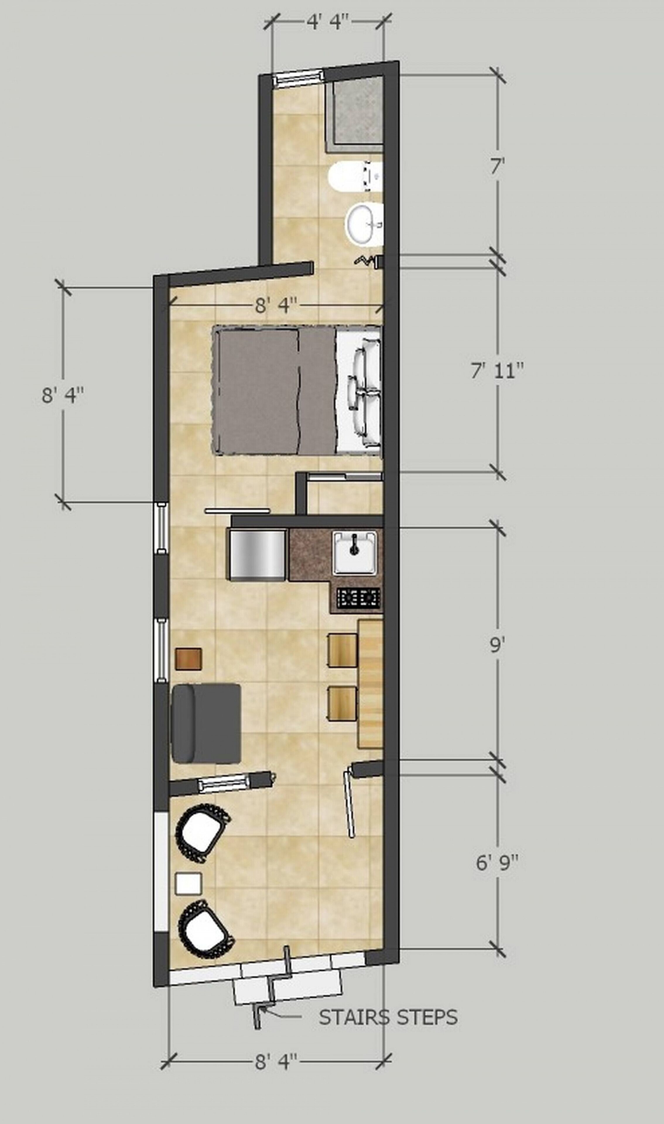 A floor plan of a hotel room with a bathroom, kitchenette, and a seating area.