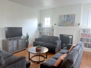 TV - Guess House: 4BR Farmhouse near Duke and Downtown with Fire Pit and Backyard! (Durham)
