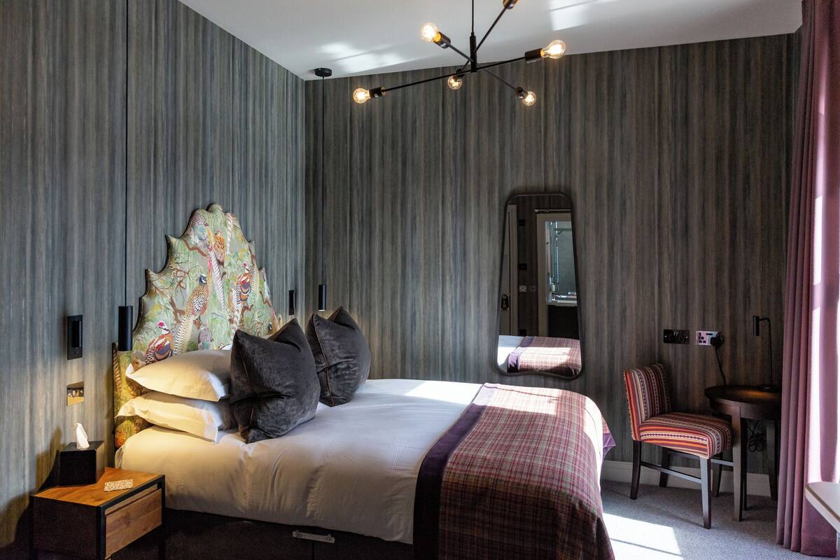 Desk, laptop workspace, blackout drapes, iron/ironing board