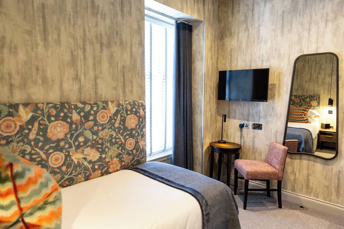 Desk, laptop workspace, blackout drapes, iron/ironing board