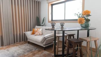 Apartment, River View | Living area | Smart TV