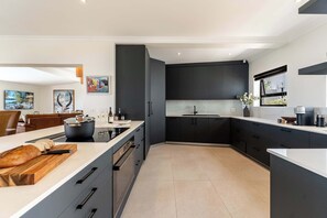 Fridge, microwave, oven, stovetop - Crystal Bay Villa - Pool, Views & Luxury Living (Cape Town)