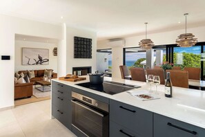 Fridge, microwave, oven, stovetop - Crystal Bay Villa - Pool, Views & Luxury Living (Cape Town)