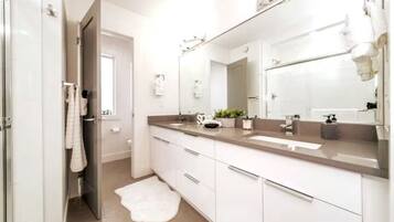 Shower, hair dryer, towels, soap