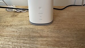 A ZTE device on a wooden surface with a white wall in the background. - Domus Philippou Tsimiski II, center of Thessaloniki (Thessaloniki)