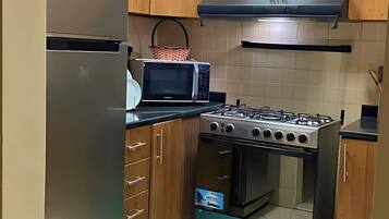 Superior Apartment, Balcony, City View | Private kitchen | Full-sized fridge, microwave, oven, cookware/dishes/utensils