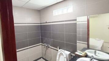 Family Room, City View | Bathroom | Shower, free toiletries, hair dryer, slippers