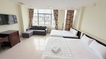 Family Room, City View | Desk, laptop workspace, blackout drapes, soundproofing