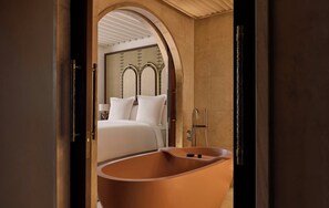 Separate tub and shower, rainfall showerhead, free toiletries