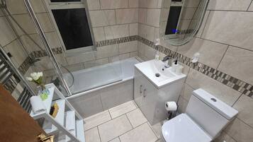 Shower, hair dryer, towels, shampoo