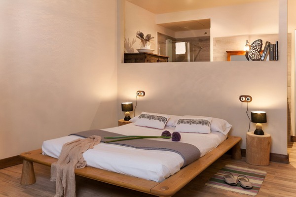 Retreat to this serene open bedroom, inviting restful nights.