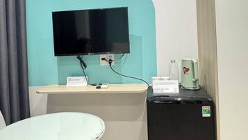 Luxury Suite, Patio, Courtyard View | Television