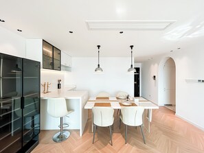 Family Suite, 2 Bedrooms, City View | Living area | TV