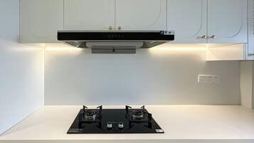 Suite familiare, 2 camere da letto, vista città | Angolo cottura privato | Prodotti per la pulizia, carta assorbente